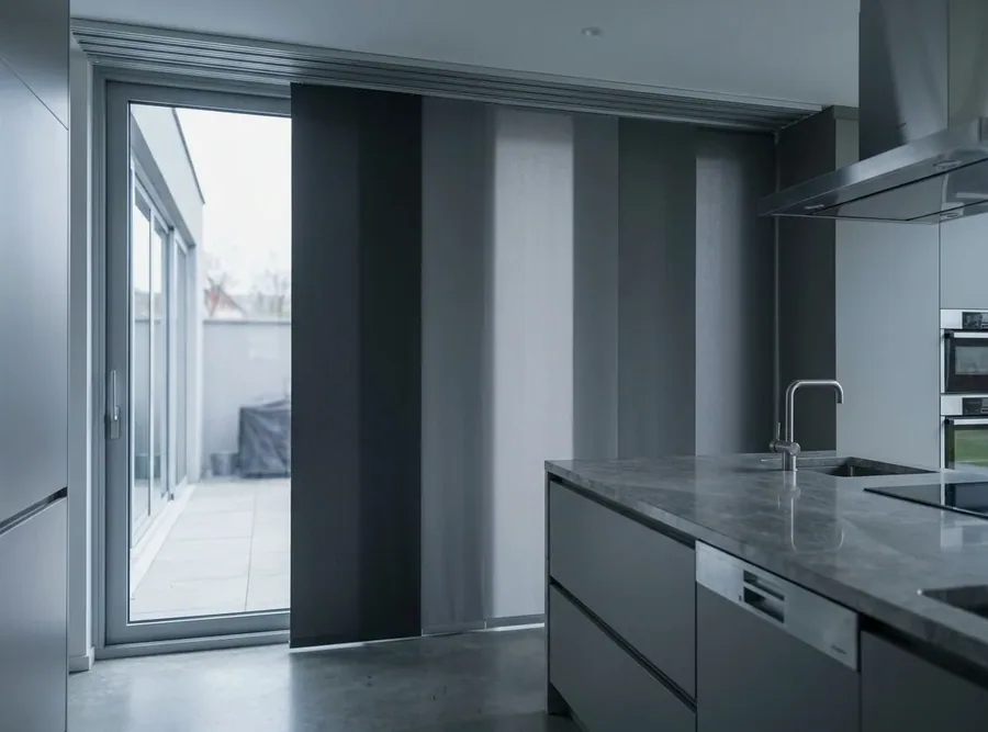 Sliding panel blinds stacked on a ceiling track beside a Hazelwood patio door