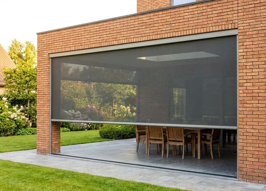 Zip screen of taut mesh running in side channels across a covered Hazelwood patio